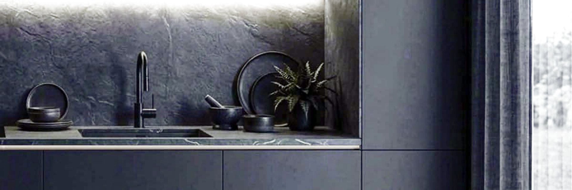 Modern dark kitchen with stone backsplash, matte cabinets and premium kitchen fittings in Dhaka